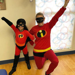 Dr. Frady in halloween costume with patient.