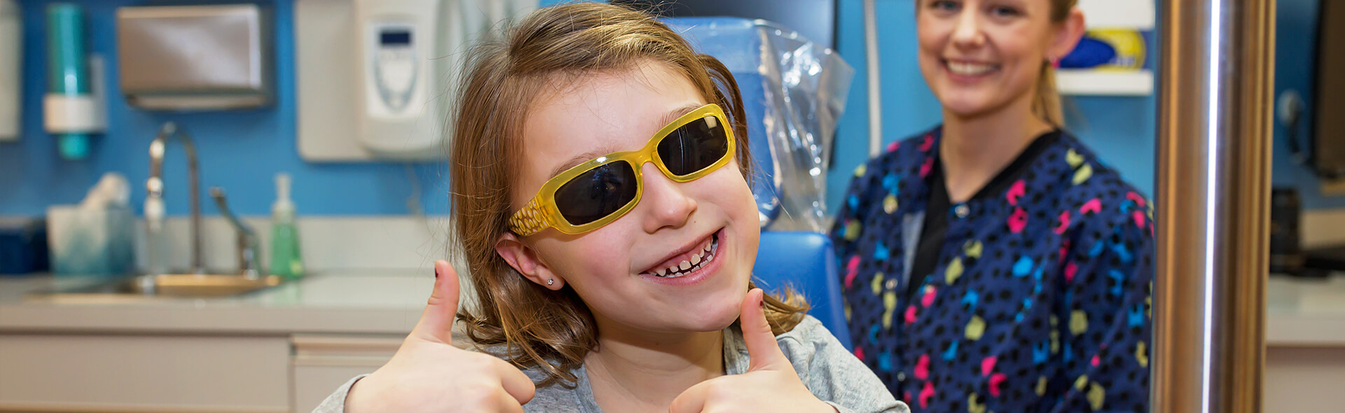 Girl with yellow glasses - Pediatric Dentist in Hales Corners, WI